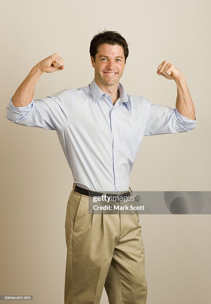 Man flexing muscles, portrait