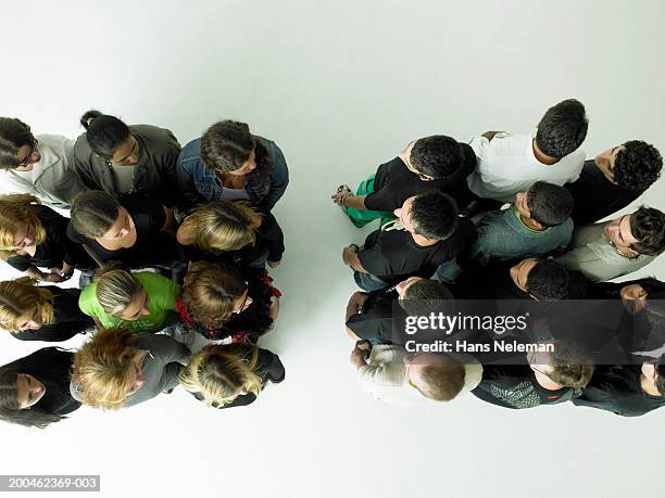 groups of men and women standing apart, view from above - community violence stock pictures, royalty-free photos & images