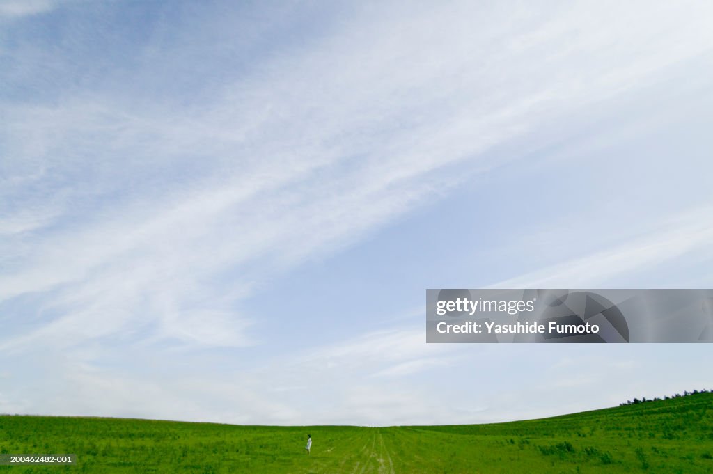 Woman standing in field