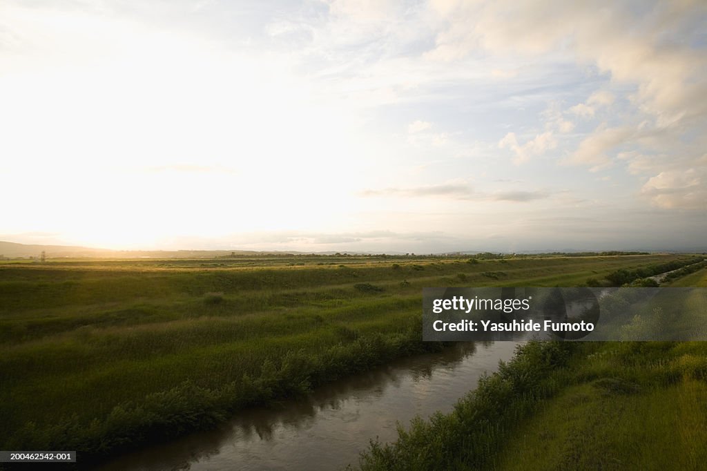 River running through field