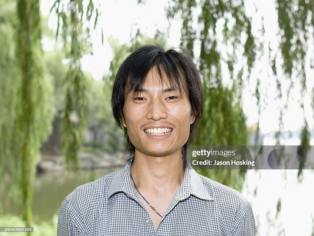 China, Beijing, Summer Palace, Kunming Lake, young man smiling