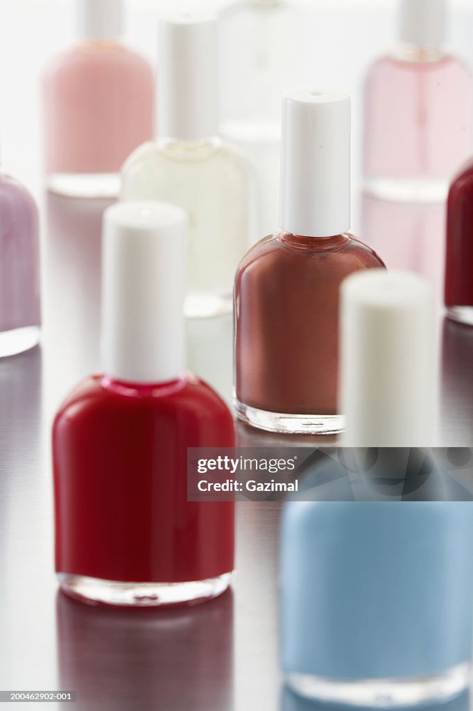 Different colored bottles of nail polish, close-up