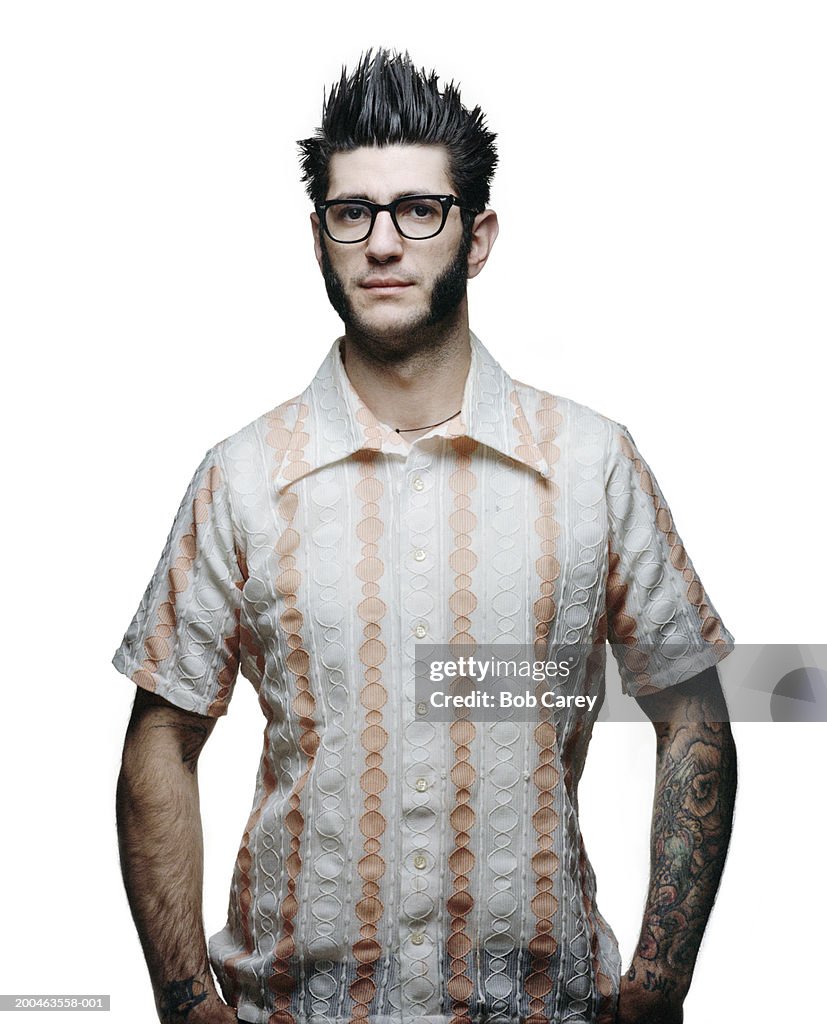 Man with pronounced sideburns wearing vintage striped shirt
