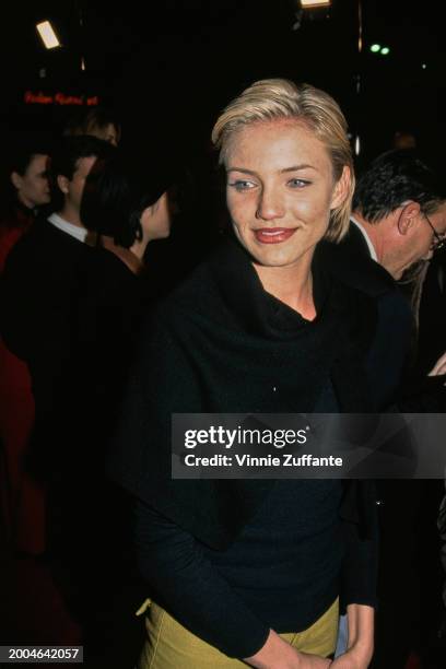 Actress Cameron Diaz, wearing a black jacket, attends the Westwood premiere of 'The People vs Larry Flynt', held at the Mann Village Theatre in the...