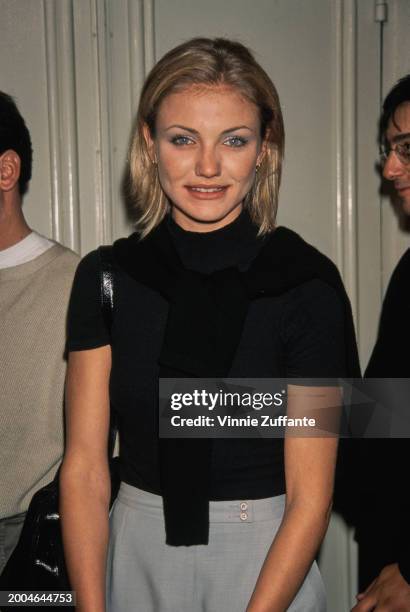 American actress Cameron Diaz, wearing a black t-shirt with grey trousers, attends the Westwood premiere of 'The Last Supper', held at the Mann...