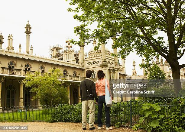 couple standing in royal pavilion, rear view - royal pavilion stock pictures, royalty-free photos & images