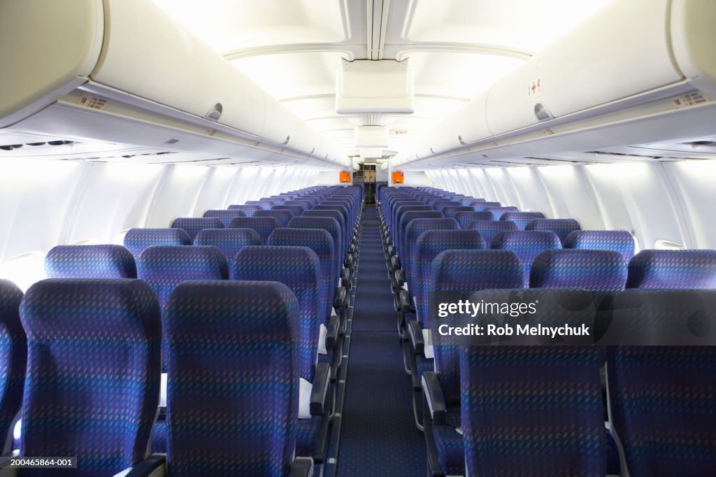 Rows of empty seats on airplane