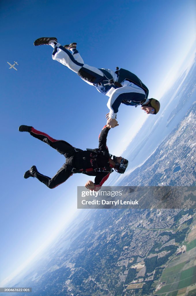 Skydivers Two Skydivers Holding Hands During Freefall Aerial View High-Res Stock ...
