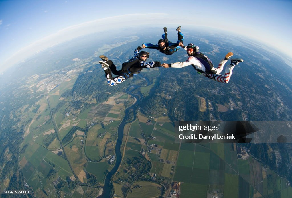 Skydivers Three Skydivers Holding Hands During Freefall Aerial View High-Res ...