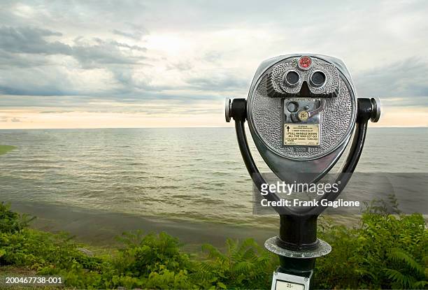 usa, new york, lake ontario, coin-operated binoculars at sunset - viewfinder stock pictures, royalty-free photos & images