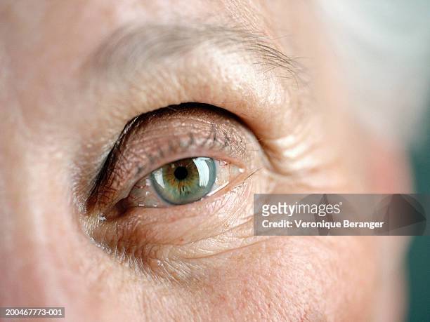 senior woman, close-up on eye - eyelid fotografías e imágenes de stock