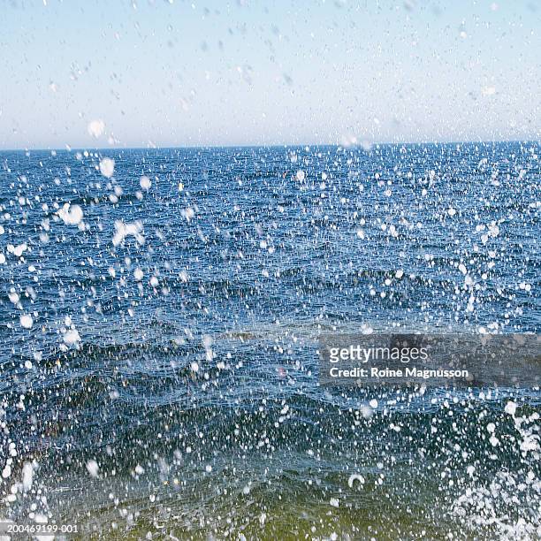 sweden, smaland, sea with spray from crashing wave - 0703ef stock pictures, royalty-free photos & images