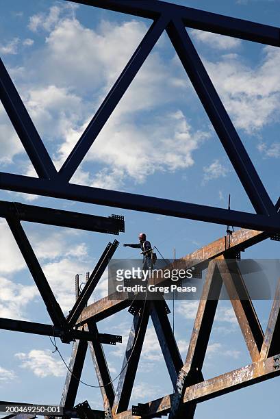steel beams of building during construction, low angle view - stahlträger stock-fotos und bilder