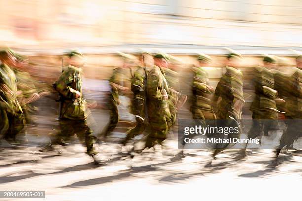 soldiers running, (blurred motion) - beret cap stock pictures, royalty-free photos & images