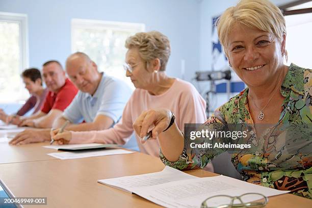 "mature woman in classroom, smiling, portrait" - mature student stock pictures, royalty-free photos & images