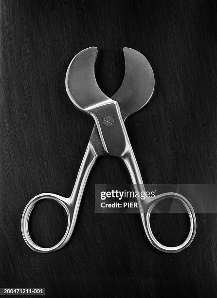 umbilical scissors against black background, close-up - surgical scissors stock pictures, royalty-free photos & images