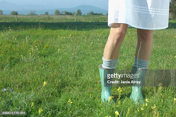 teenage girl (16-18) wearing wellington boots, low section - knee length stock pictures, royalty-free photos & images