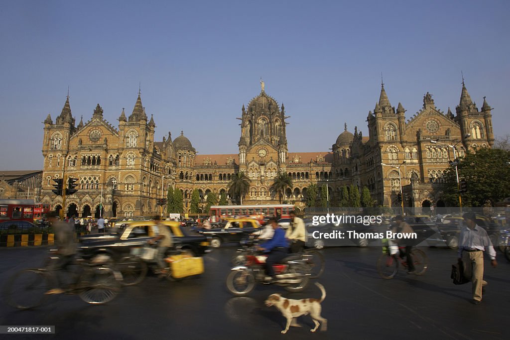 "India, Mumbai, Chhatrapati Shivaji Terminus, pedestrians in foreground"