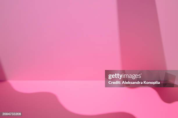 empty studio 3d exhibition background - pastel pink stage with soft natural abstract diagonal wavy shadows, architectural window light. front view, copy space. - stage light 3d stock pictures, royalty-free photos & images
