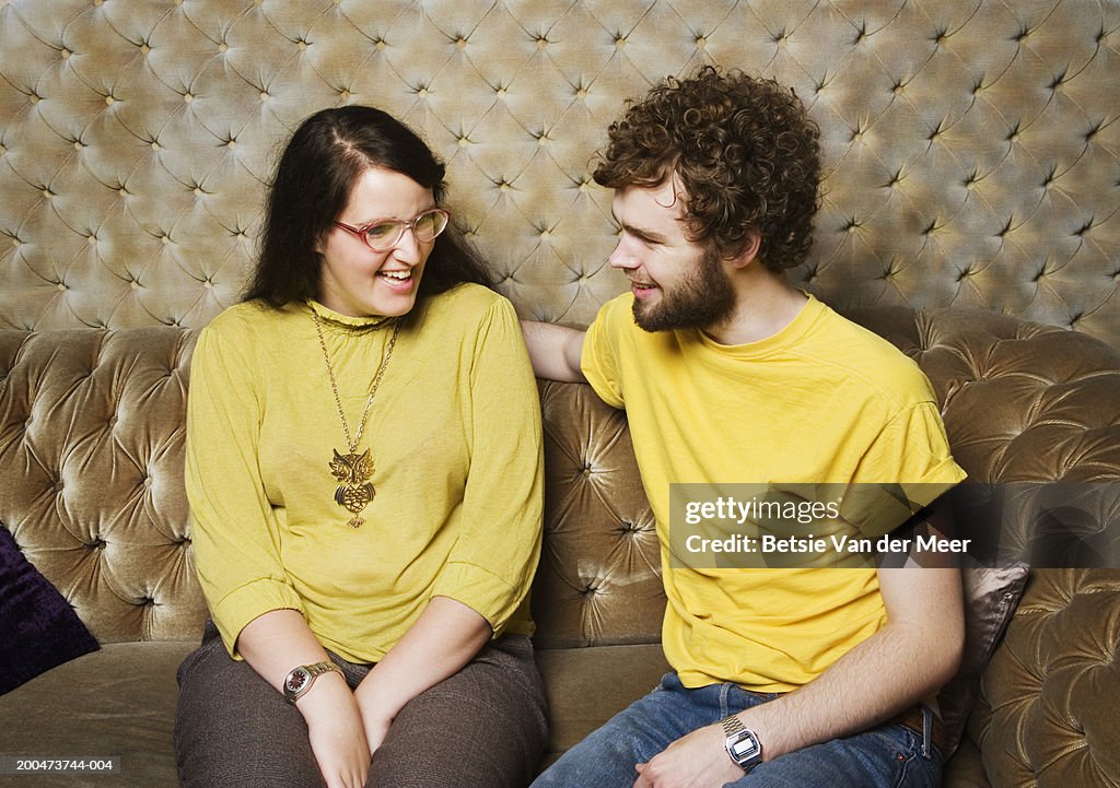 Young couple sitting on sofa