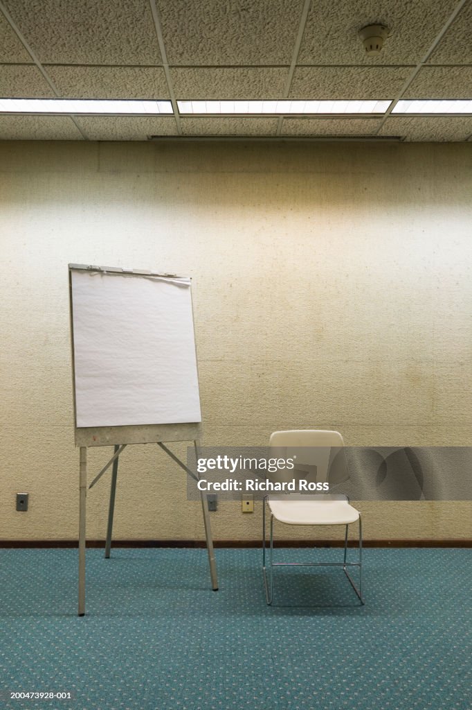 Chair and writing board in room