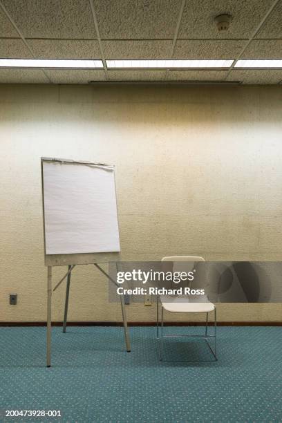 chair and writing board in room - flipchart stock pictures, royalty-free photos & images