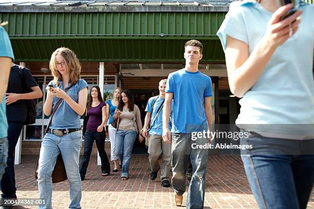 young students walking out of college - disembarking stock-fotos und bilder