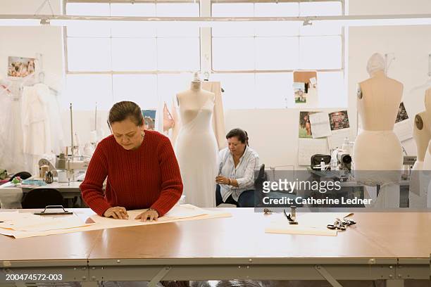 mature women working in wedding dress factory - sewing pattern bildbanksfoton och bilder