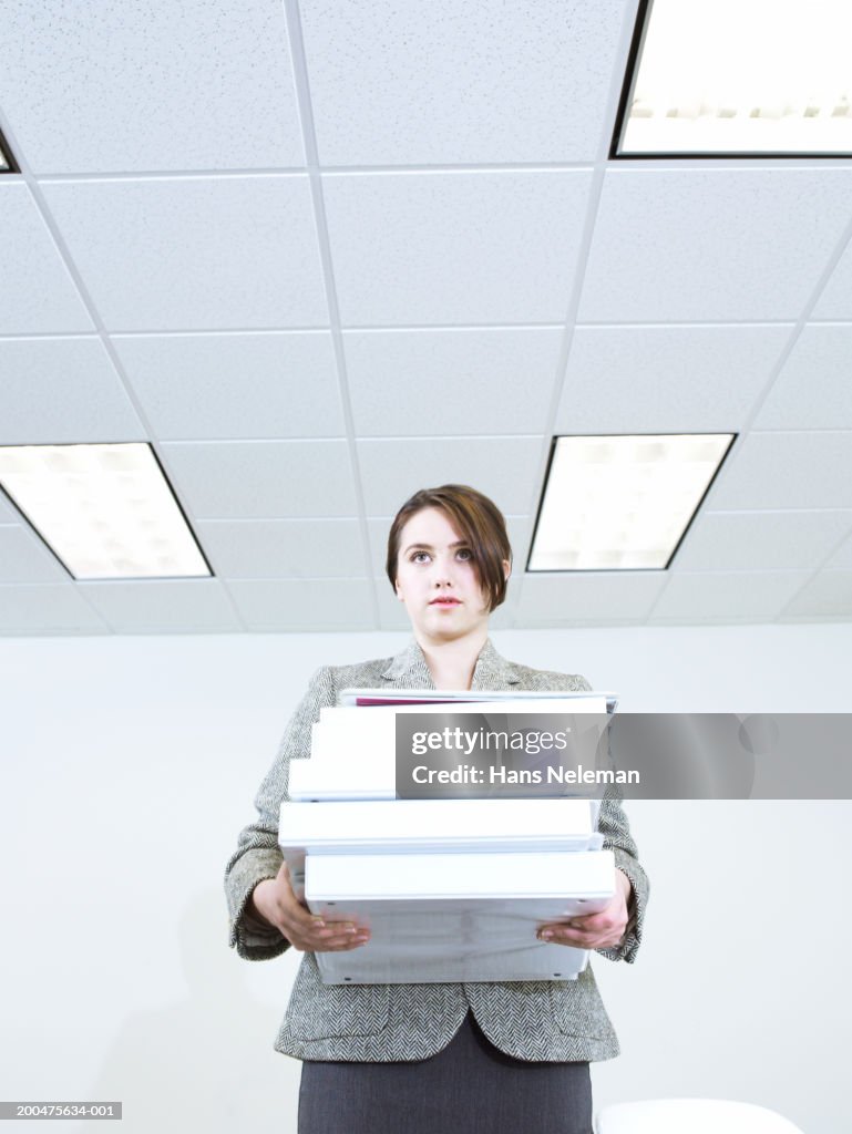 Young businesswoman carrying packages