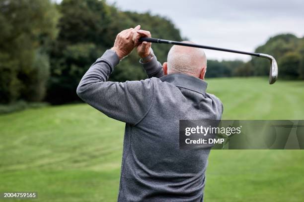 golf, swing and senior man on grass for game, sports club and playing for weekend hobby in retirement. hit, course and person on green for competition, outdoor challenge and elderly golfer from back. - strike back stock pictures, royalty-free photos & images