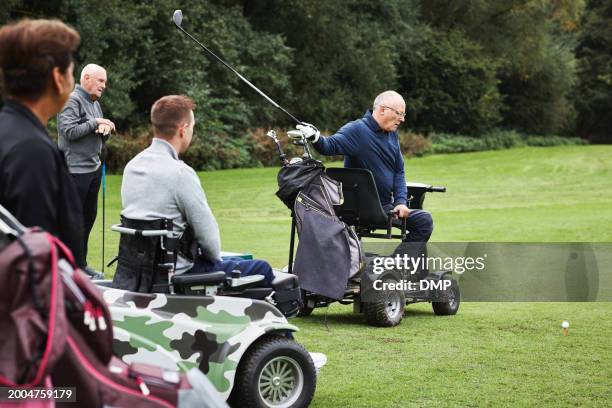 sports, swing and men in wheelchair for golf in game, match and competition on golfing course. recreation, hobby and senior man with person with disability with club for training, fitness or practice - active seniors golf stock pictures, royalty-free photos & images