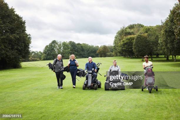 sports, mobility scooter and people for golf game, match and competition on golfing course. recreation, person with disability and women and men with caddy for training, fitness and practice outdoors - active seniors golf stock pictures, royalty-free photos & images