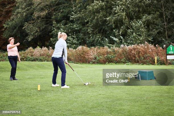 sports, golf and woman with personal trainer for game, competition and practice on golfing course. fitness coach, equipment and women on field for training, learning skill and exercise outdoors - championship day two stock pictures, royalty-free photos & images