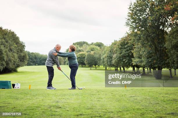 sports, golf and mature man with personal trainer for game, competition and practice on golfing course. fitness coach, retirement and people with club for training, match and learning skill outdoors - active seniors golf stock pictures, royalty-free photos & images