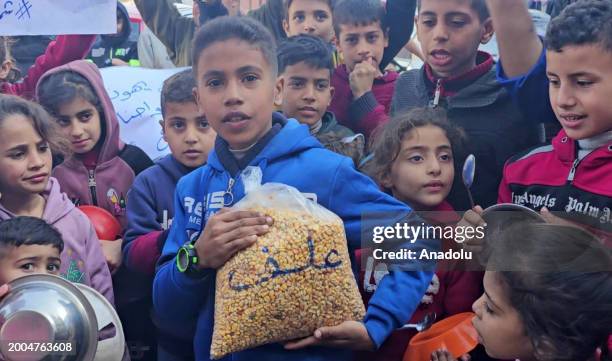 Children who fled their homes and took refuge with their families at a school in Jabalia refugee camp due to the Israeli attacks held a demonstration...