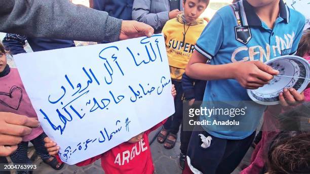 Children who fled their homes and took refuge with their families at a school in Jabalia refugee camp due to the Israeli attacks held a demonstration...