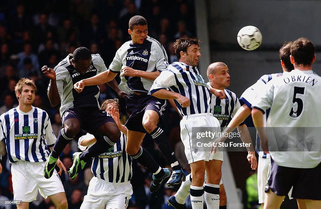 Jermaine Jenas of Newcastle United wins the ball in the air to score the opening goal of the match
