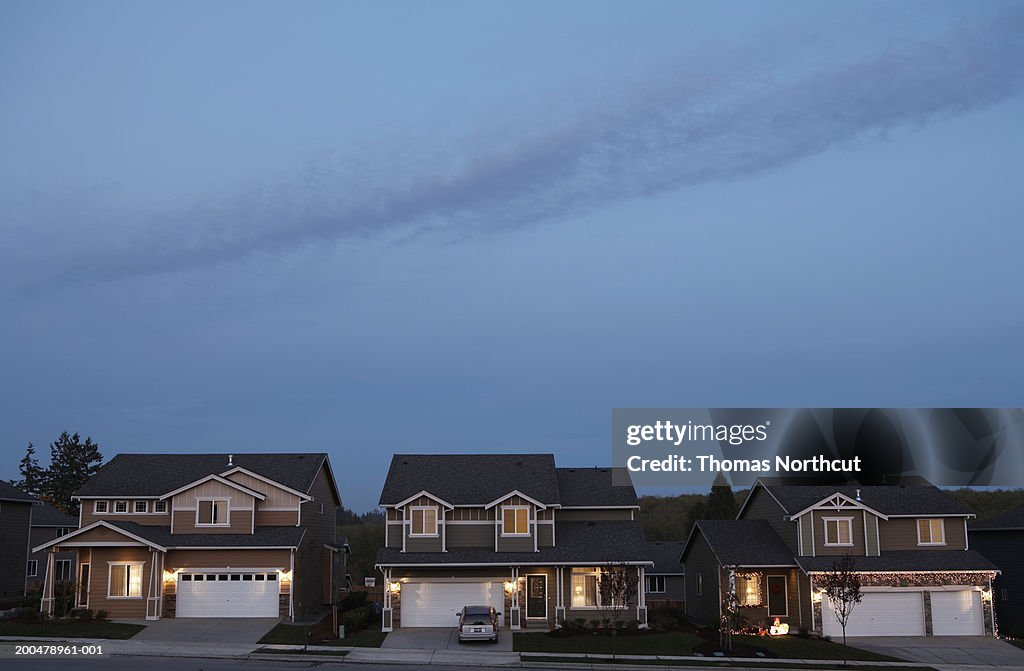 Row of houses illuminated at dusk