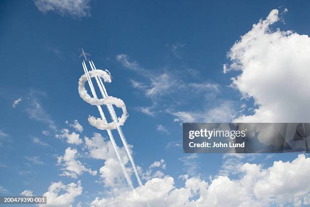 jet trail creating dollar sign - us currency stock pictures, royalty-free photos & images