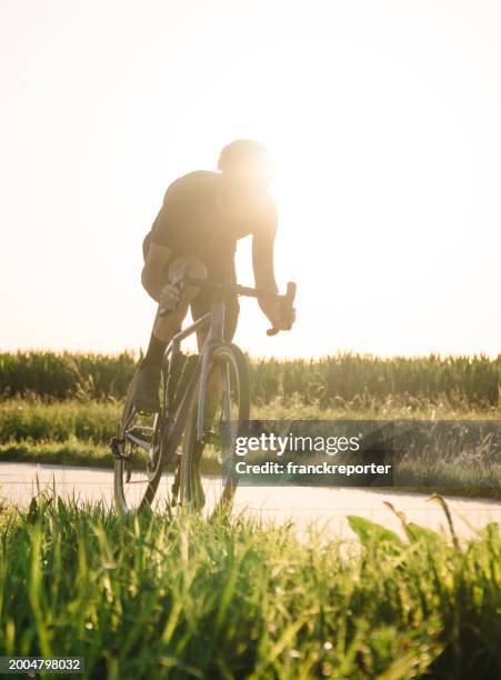 professional biker on the road - cycling race stock pictures, royalty-free photos & images