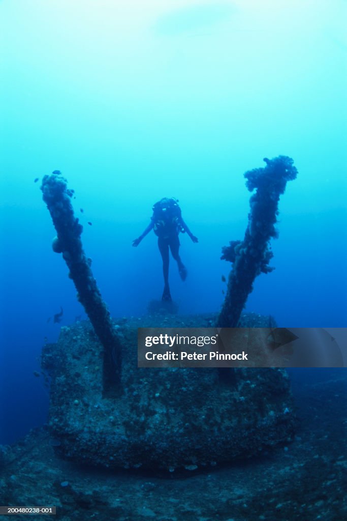 Marshall Islands Female Diver Exploring Aircraft Carrier High-Res Stock