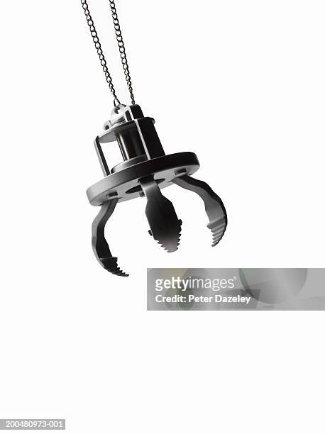 toy grabber, against white background, close-up - claw machine stock pictures, royalty-free photos & images