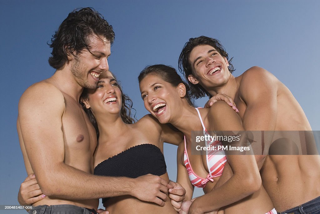Two young couples laughing