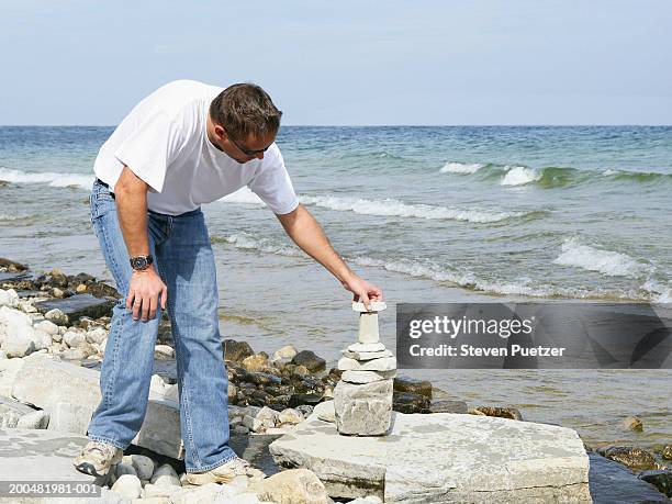Putting Rocks On Rocks Putting Stones Photos and Premium High Res Pictures - Getty Images