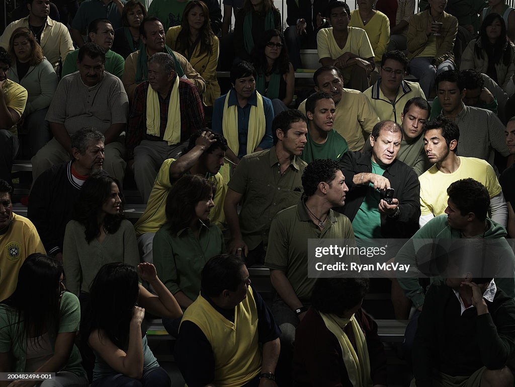 Commotion In Crowd Spotlight On Person In Crowd