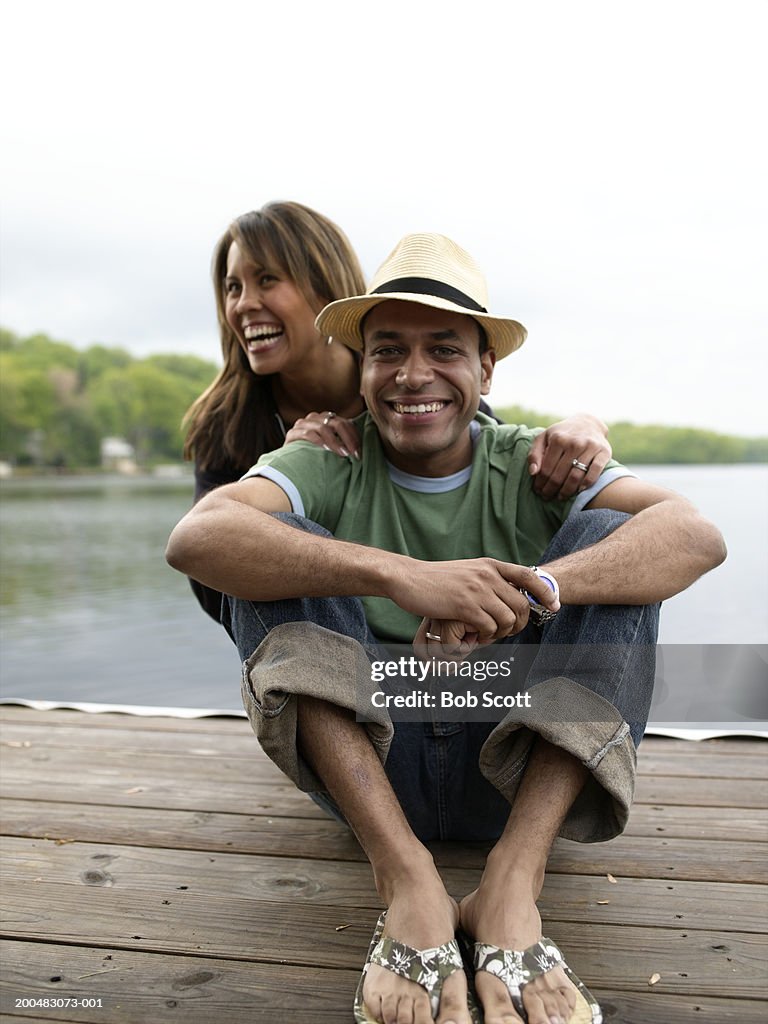 Couple on dock, laughing