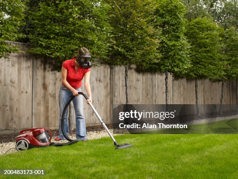 Woman Wearing Gas Mask Vacuuming Lawn High-Res Stock Photo - Getty Images