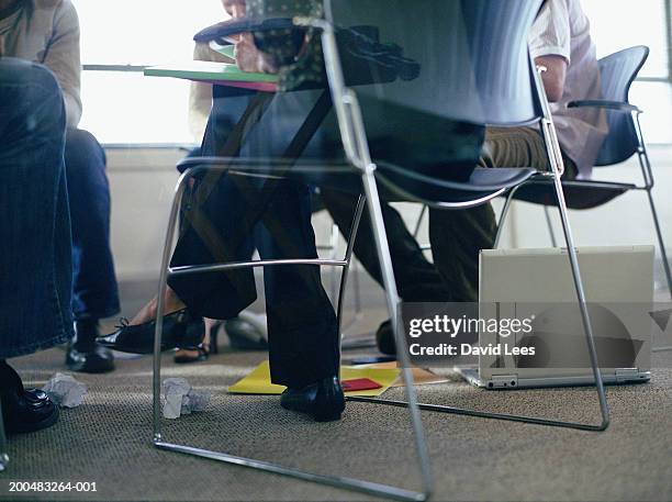 business people having meeting in office, low section - 40's rumpled business man stockfoto's en -beelden