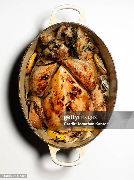 roast chicken in pan, overhead view - roasted stock pictures, royalty-free photos & images