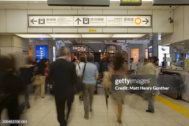 japan, tokyo, commuters in station (long exposure) - japan commuters stock pictures, royalty-free photos & images